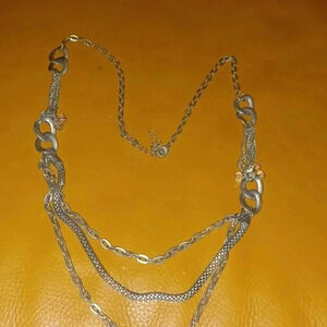 Necklace with different types of chains combined together for fun appearance